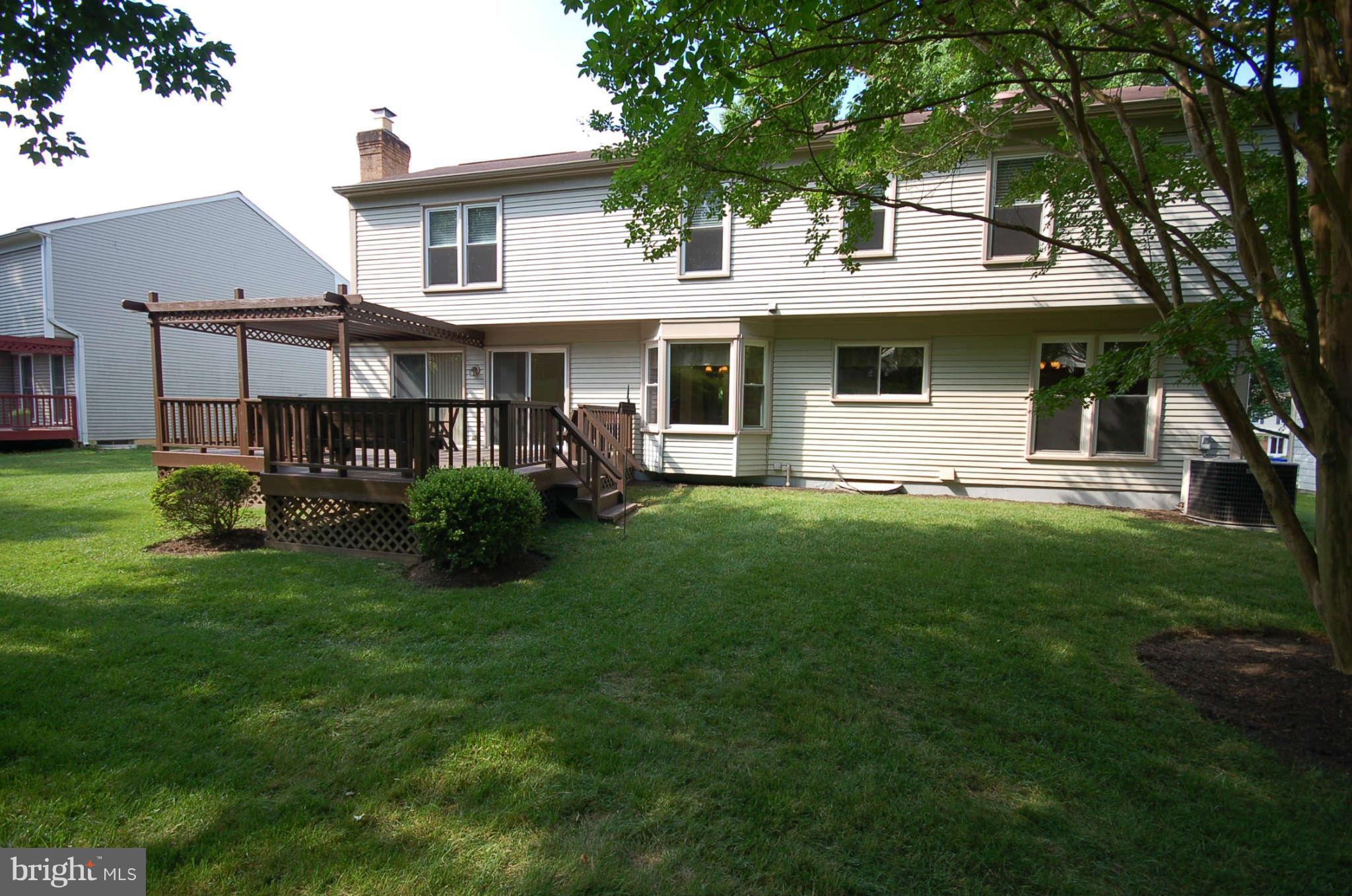 13807 Turnmore Road Silver Spring, MD 20906 - Photo 22 of 26 a front view of a house with a yard