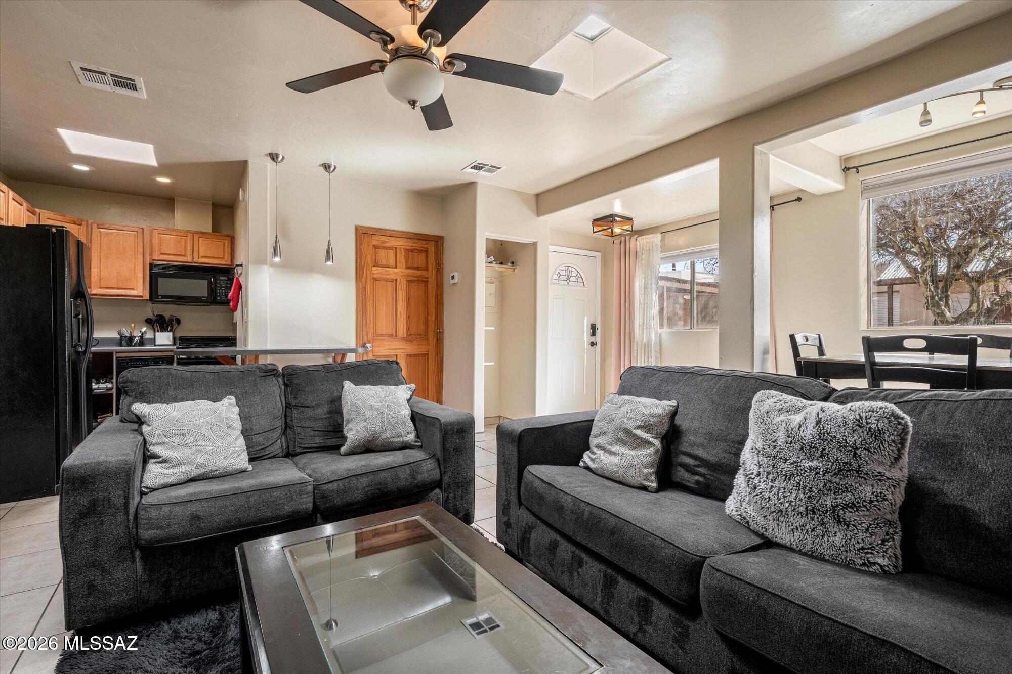 2619 East Prince Road Tucson, AZ 85716 - Photo 35 of 50 a living room with furniture and a large window