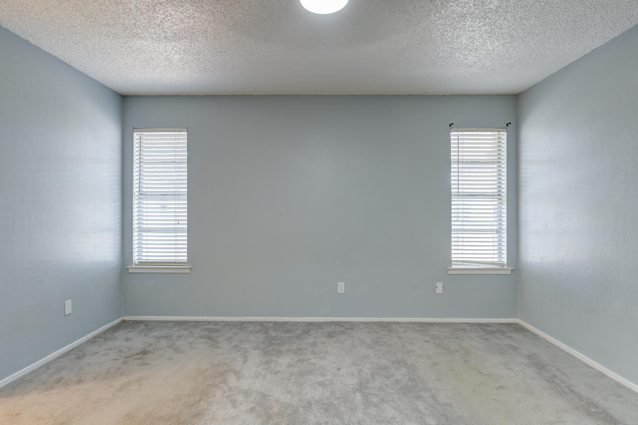 5018 70th Street Lubbock, TX 79424 - Photo 16 of 27 an empty room with windows