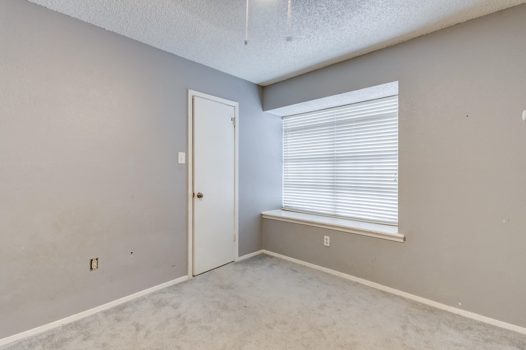 5018 70th Street Lubbock, TX 79424 - Photo 20 of 27 a view of an empty room with a window