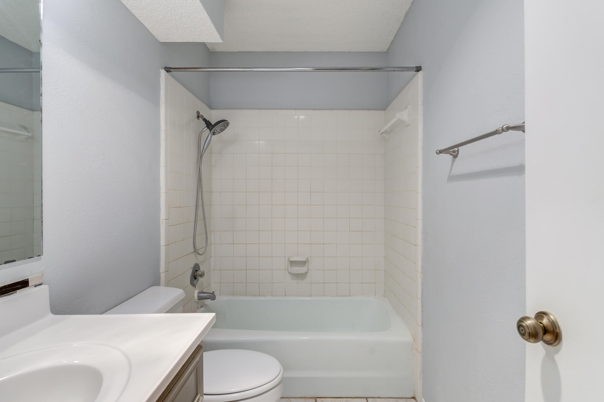 5018 70th Street Lubbock, TX 79424 - Photo 22 of 27 a bathroom with a sink toilet and shower
