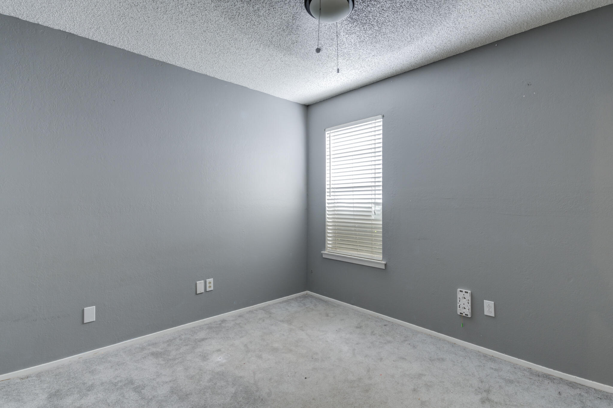 5018 70th Street Lubbock, TX 79424 - Photo 23 of 27 a view of an empty room with a window