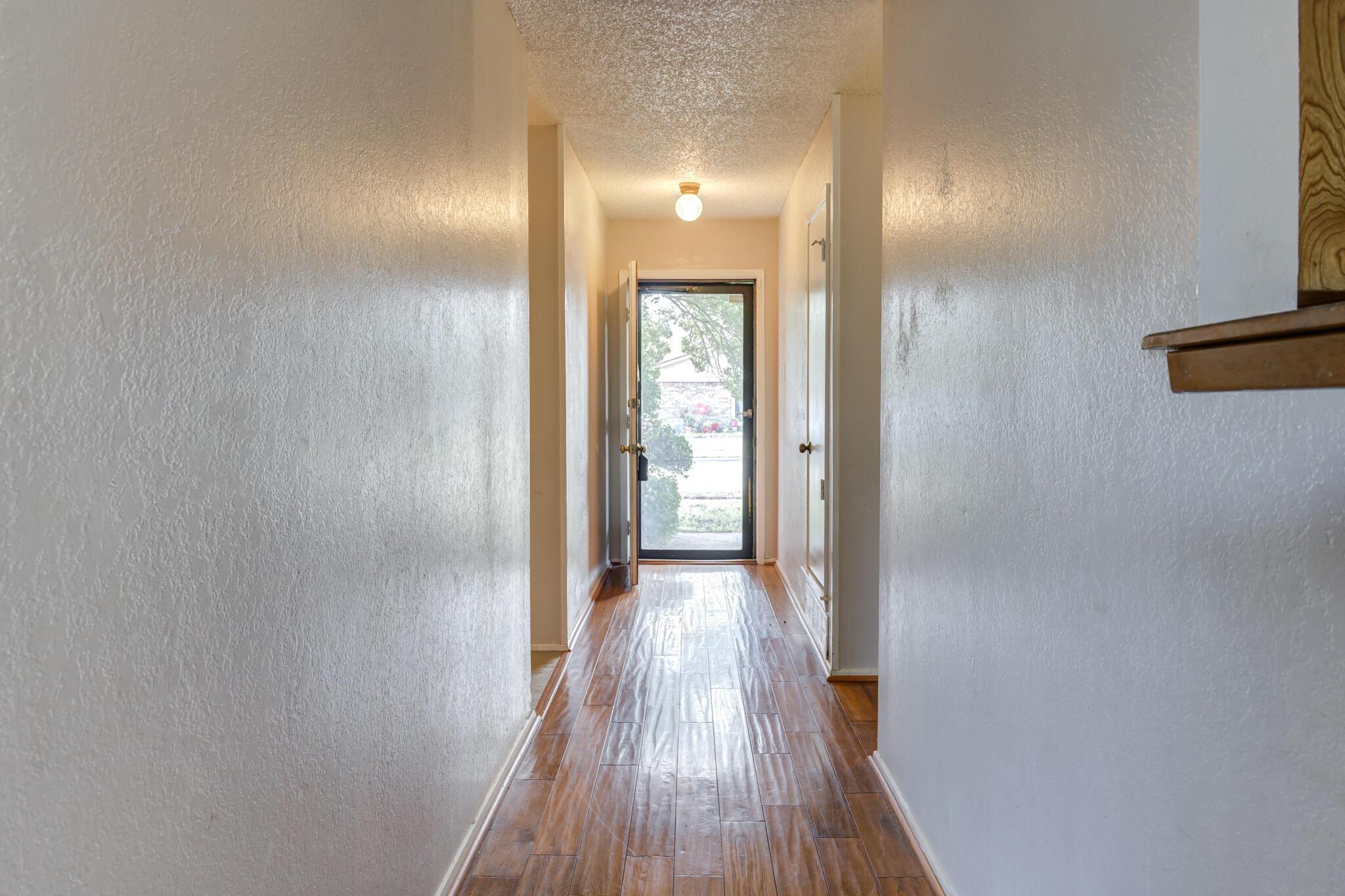5018 70th Street Lubbock, TX 79424 - Photo 3 of 27 a view of hallway with wooden floor