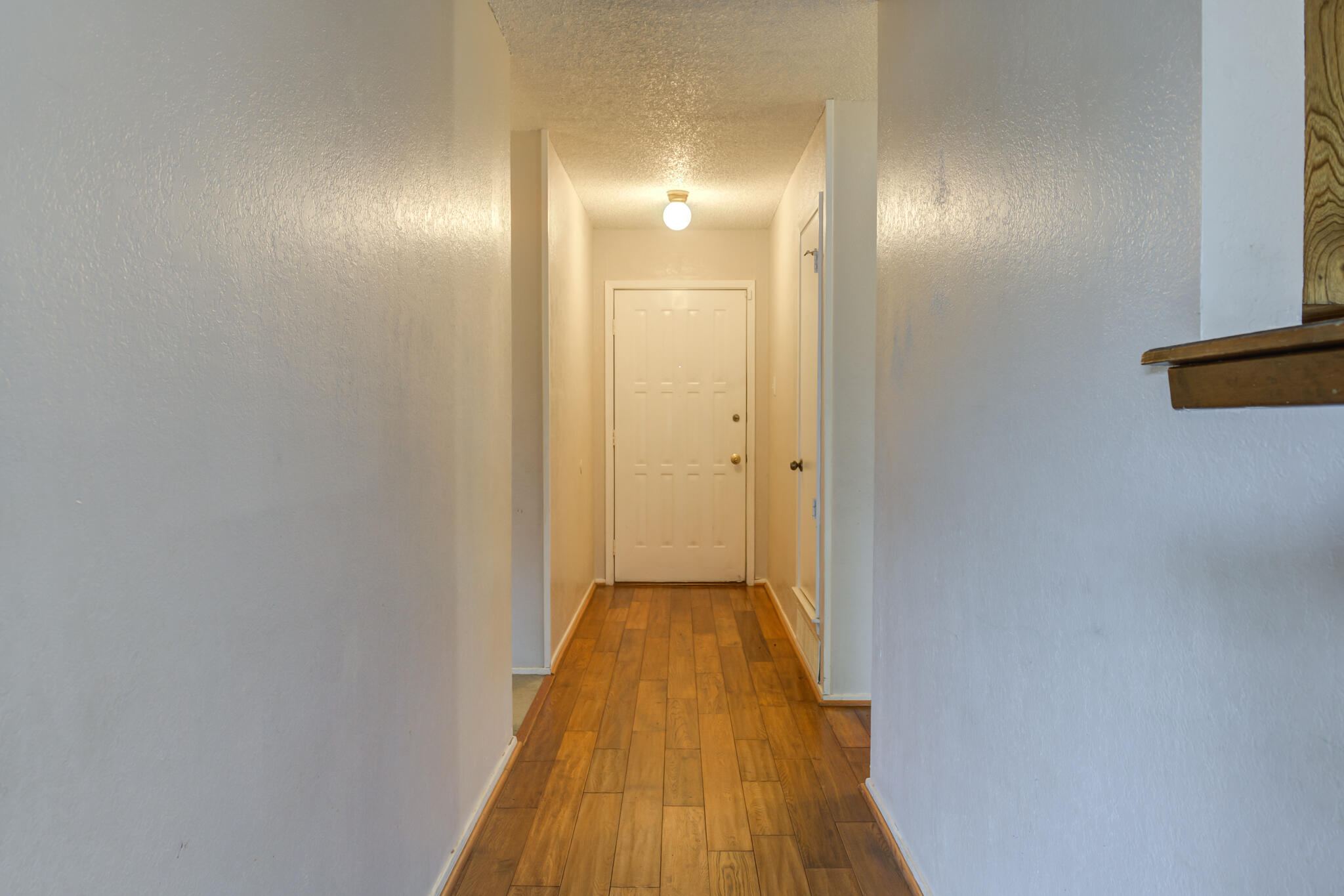 5018 70th Street Lubbock, TX 79424 - Photo 4 of 27 a view of a hallway with wooden floor