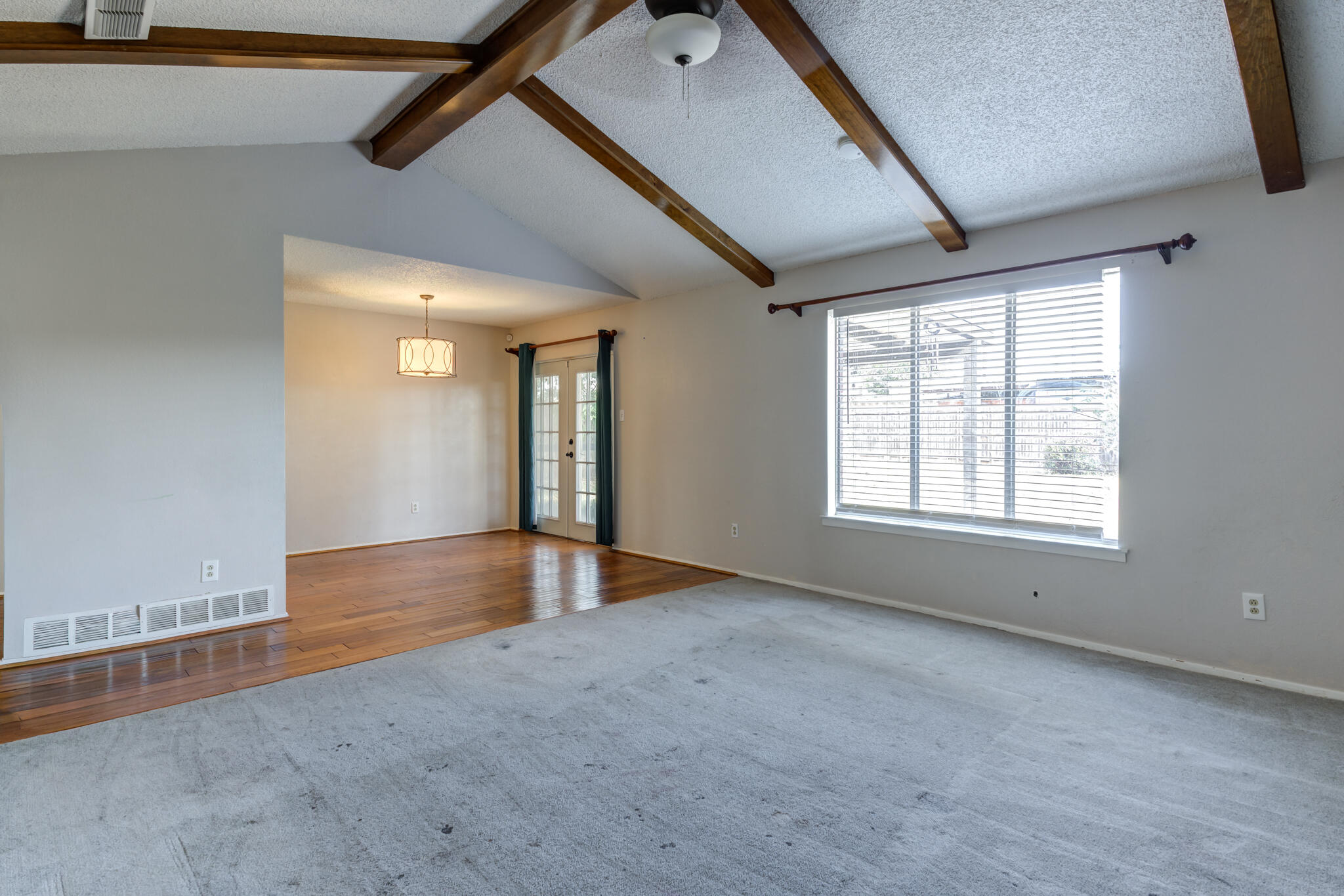 5018 70th Street Lubbock, TX 79424 - Photo 8 of 27 a view of an empty room with a window