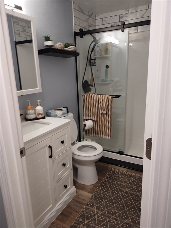 1475 Braley Road, Unit 17 New Bedford, MA 02745 - Photo 12 of 13 a bathroom with a toilet a sink and shower