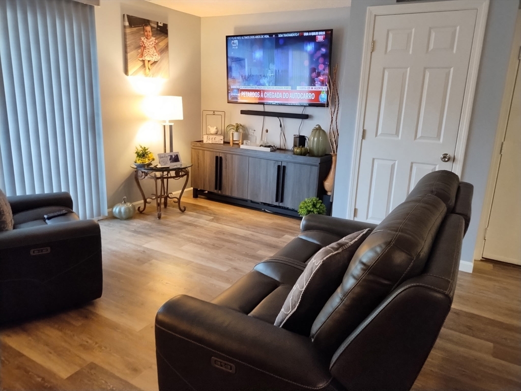 1475 Braley Road, Unit 17 New Bedford, MA 02745 - Photo 4 of 13 a living room with furniture and a window