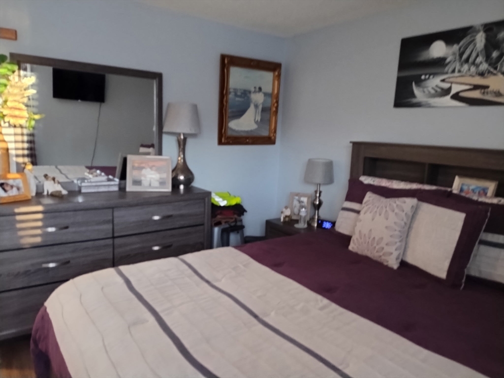 1475 Braley Road, Unit 17 New Bedford, MA 02745 - Photo 9 of 13 a bedroom with a bed window and dresser