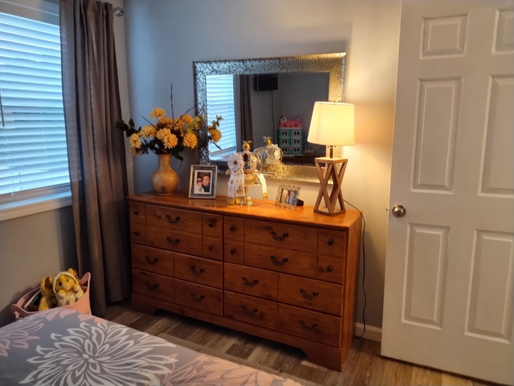 1475 Braley Road, Unit 17 New Bedford, MA 02745 - Photo 10 of 13 a bed room with a bed and a dresser