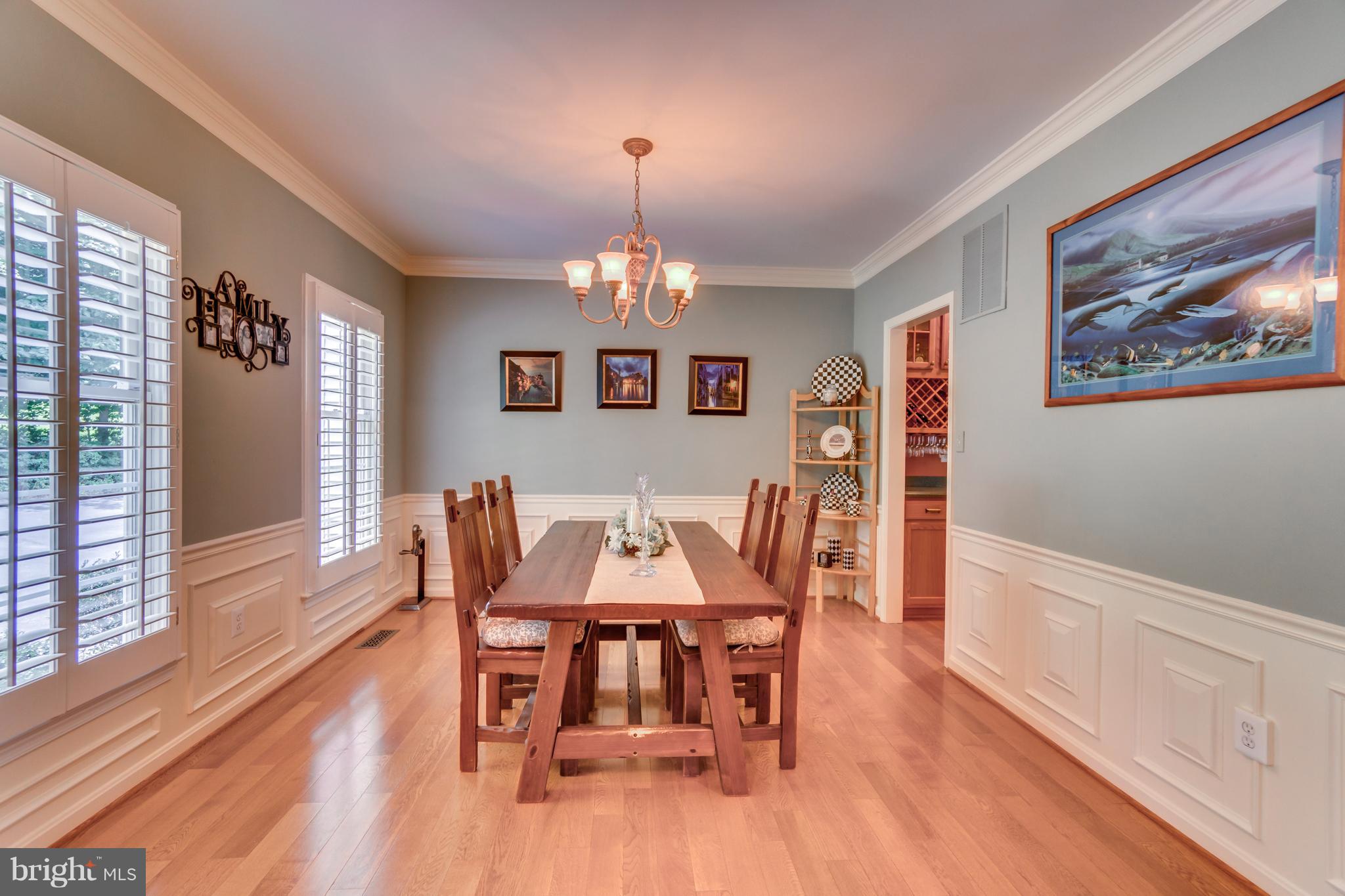 6601 Hunters Ridge Road Manassas, VA 20112 - Photo 4 of 30 Plantation shutters and wainscoting in Dining Room