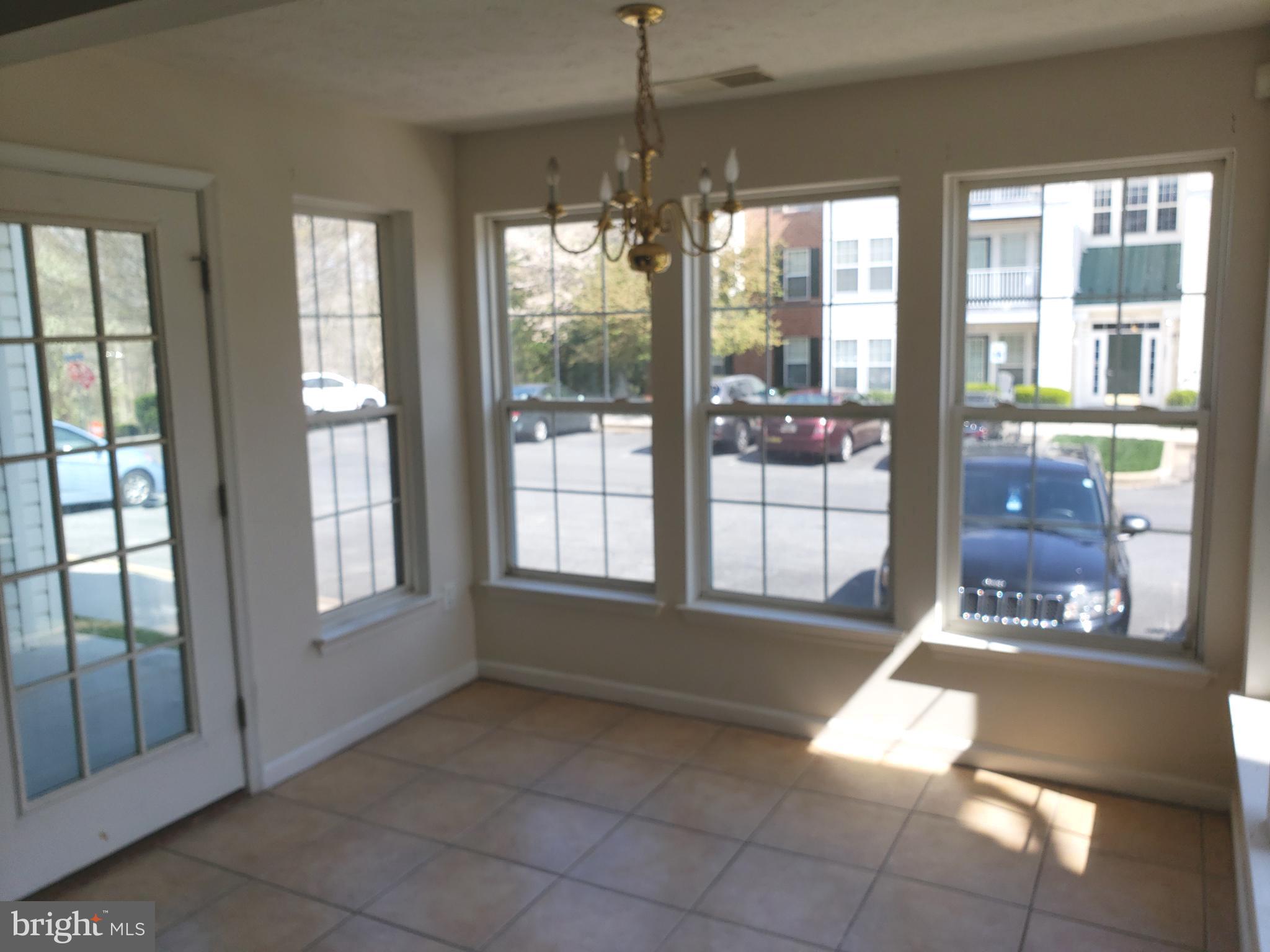 4915 Riders Court Owings Mills, MD 21117 - Photo 18 of 23 BREAKFAST ROOM - WITH REAR UNIT ENTRY DOOR