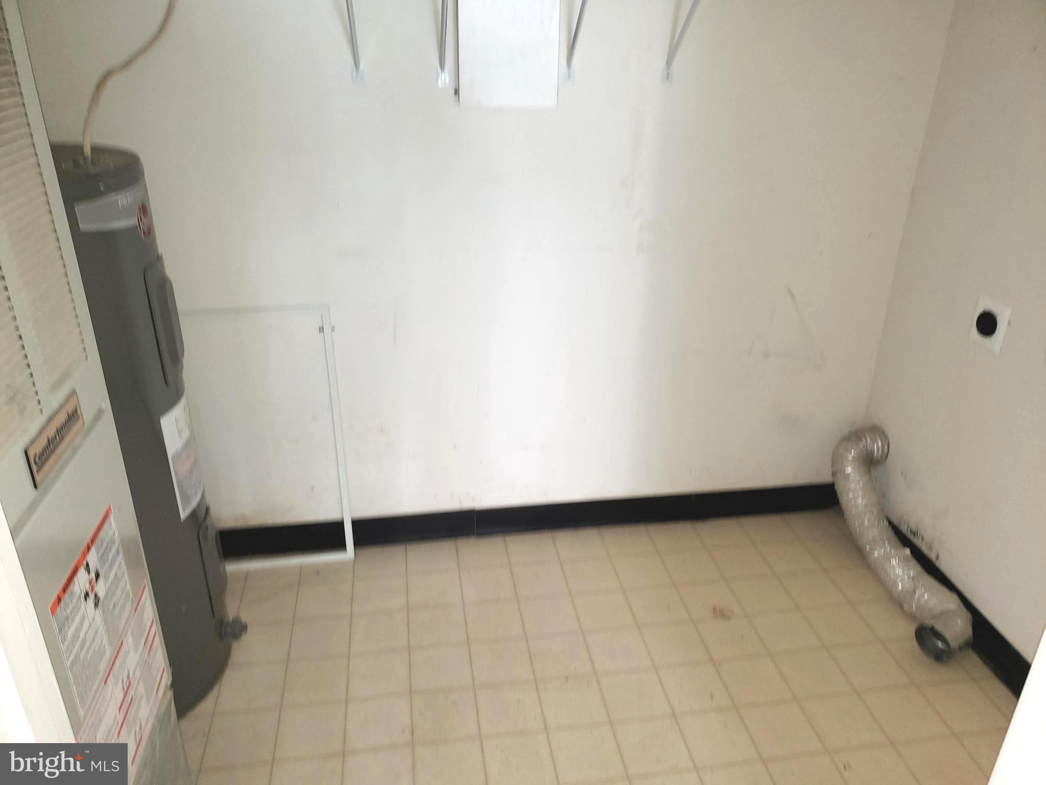 4915 Riders Court Owings Mills, MD 21117 - Photo 22 of 23 UTILITY ROOM - LAUNDRY AREA