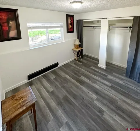 a view of kitchen and wooden floor