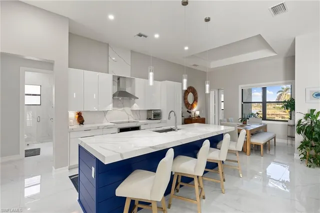 a kitchen with a table and chairs in it