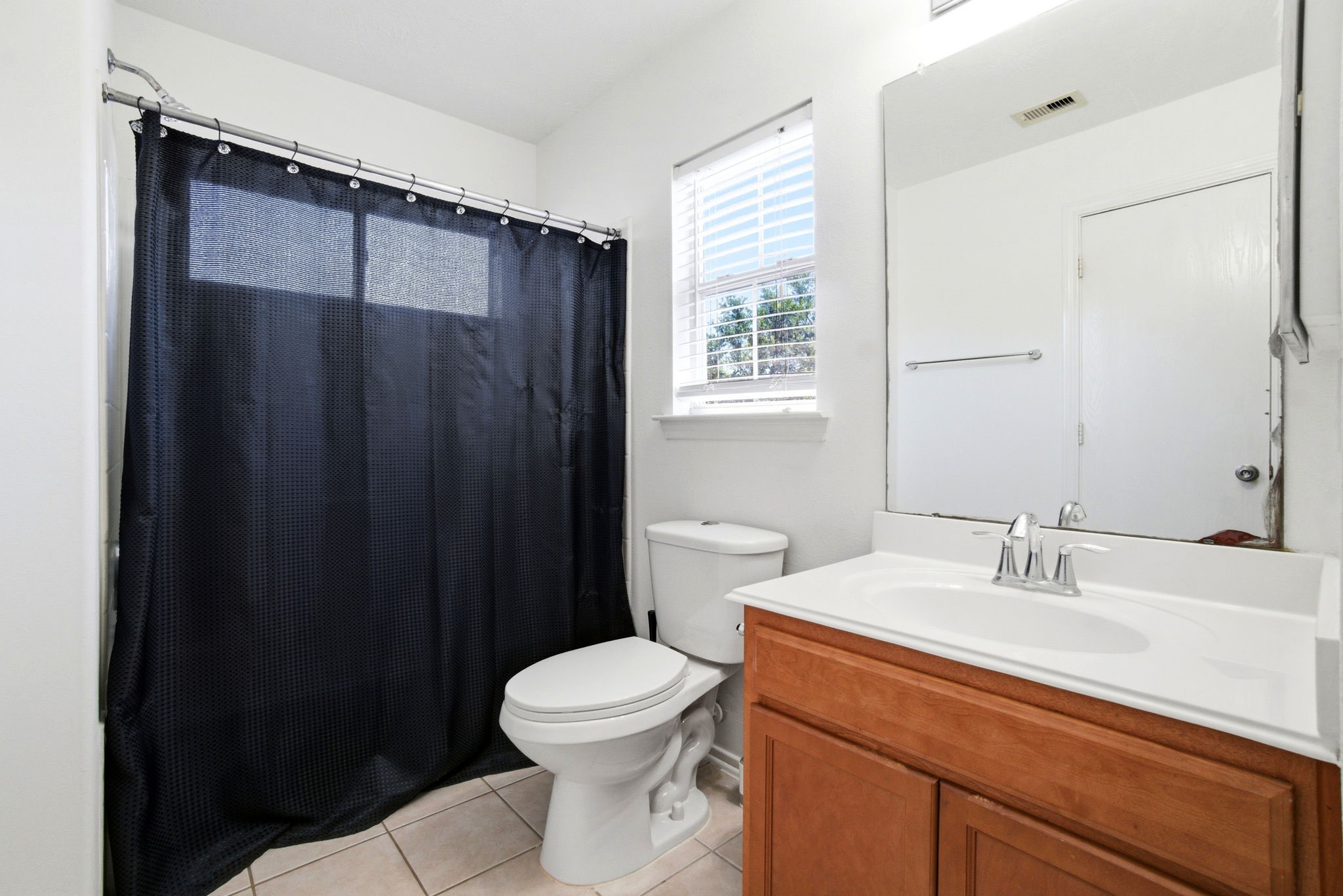 1607 Redbud Grove Court Conroe, TX 77301 - Photo 17 of 21 a bathroom with a sink a toilet and shower