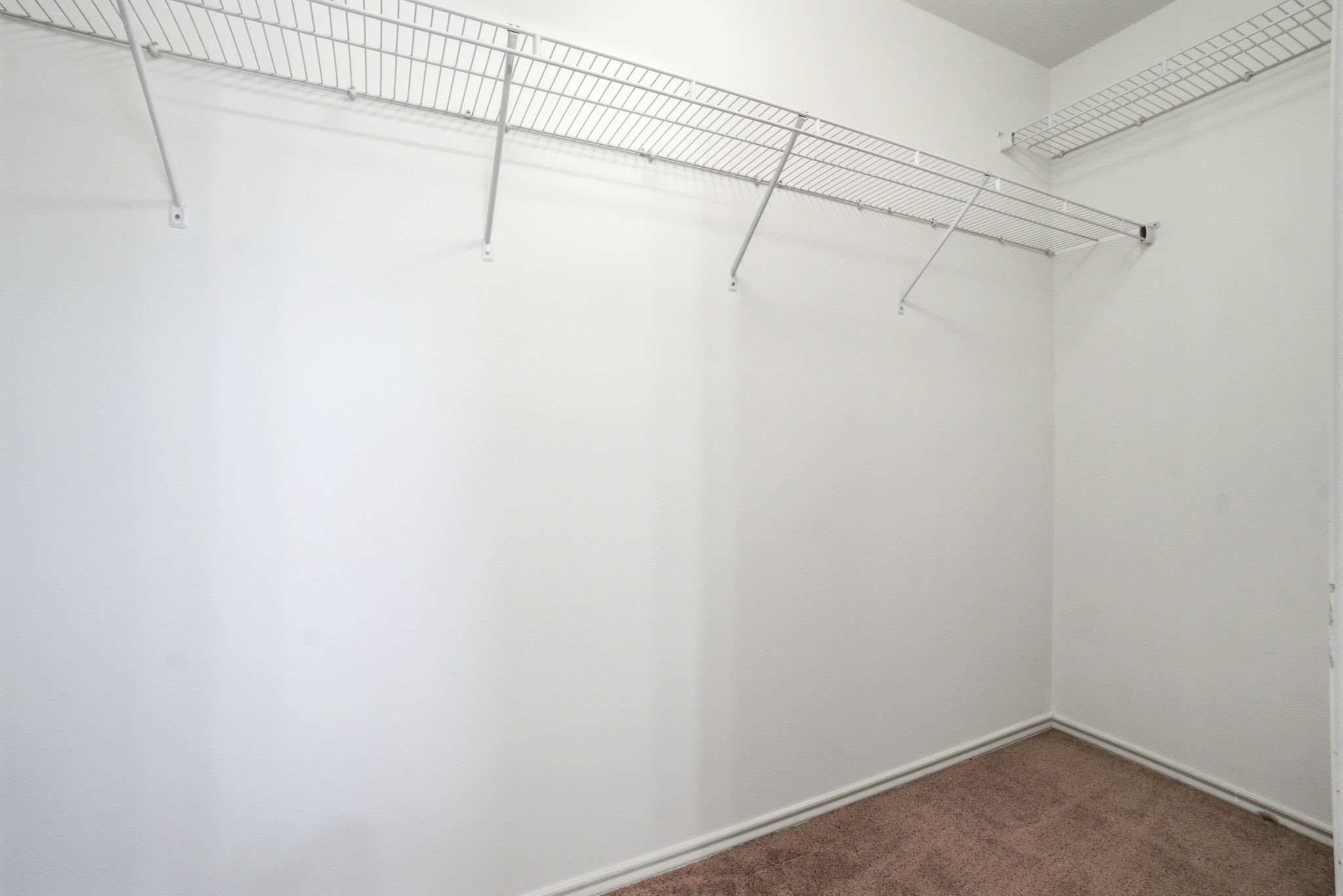 1607 Redbud Grove Court Conroe, TX 77301 - Photo 18 of 21 a view of a room with racks on the wall