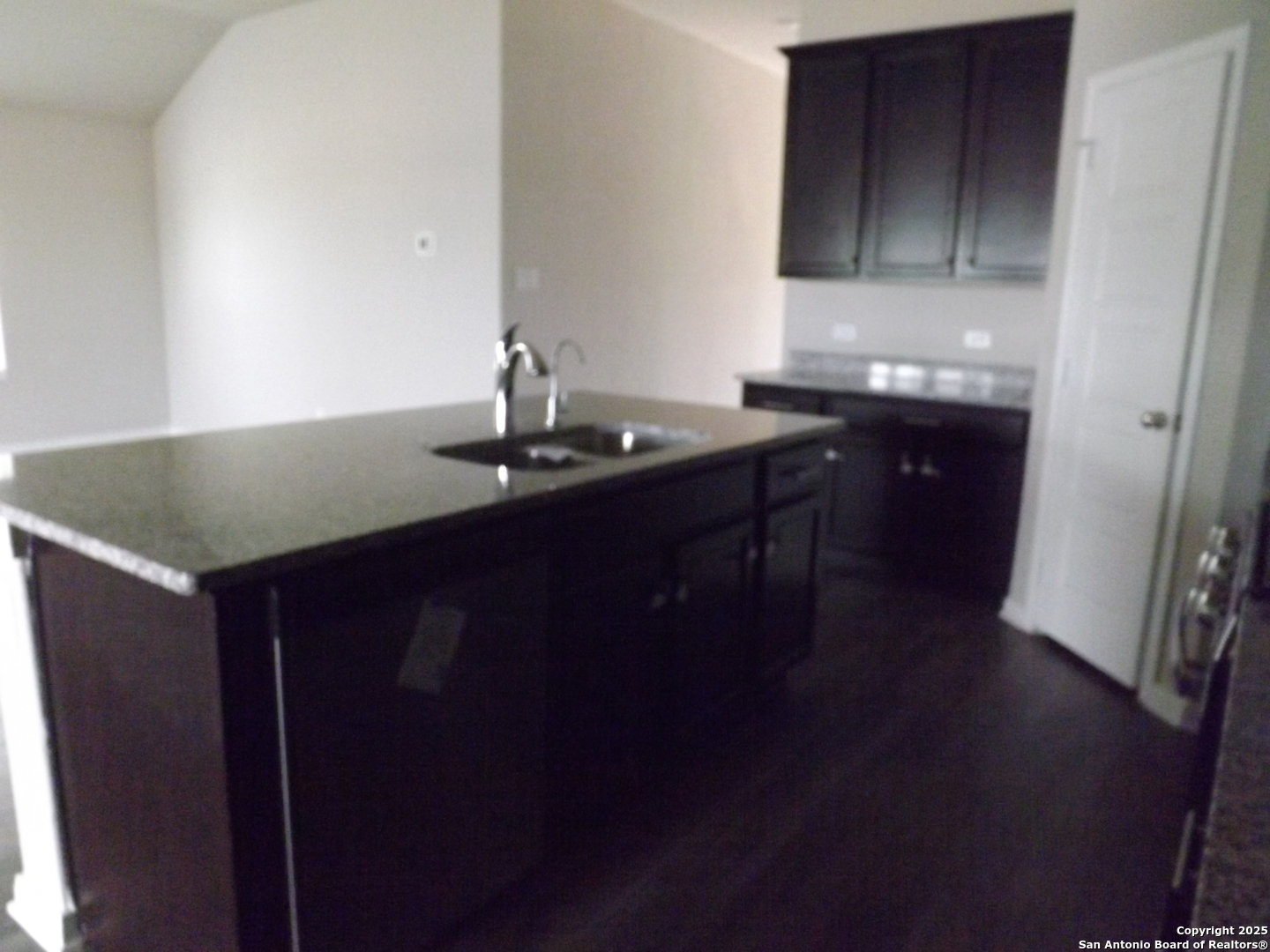 6722 Shiraz Way Converse, TX 78109 - Photo 27 of 30 a kitchen with a sink cabinets and wooden floor