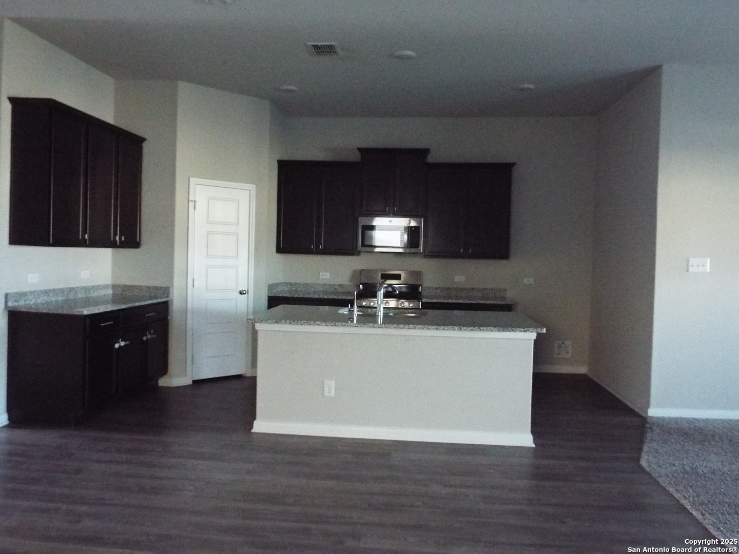 6722 Shiraz Way Converse, TX 78109 - Photo 5 of 30 a kitchen with a sink and a refrigerator