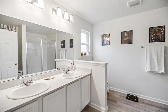 a bathroom with a sink a vanity and a mirror