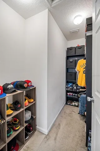 a room with furniture a flat screen tv and a window