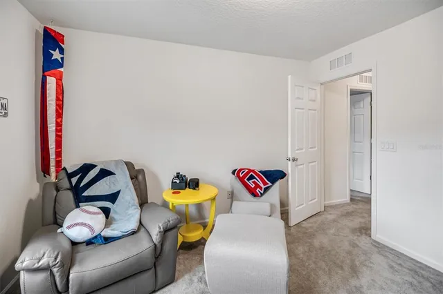 a bedroom with a bed and a table