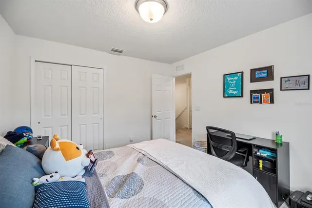 a view of wooden floor and windows in a room