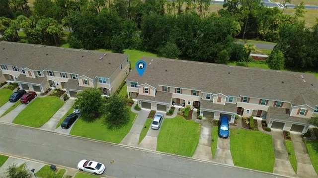 an aerial view of a house with a garden