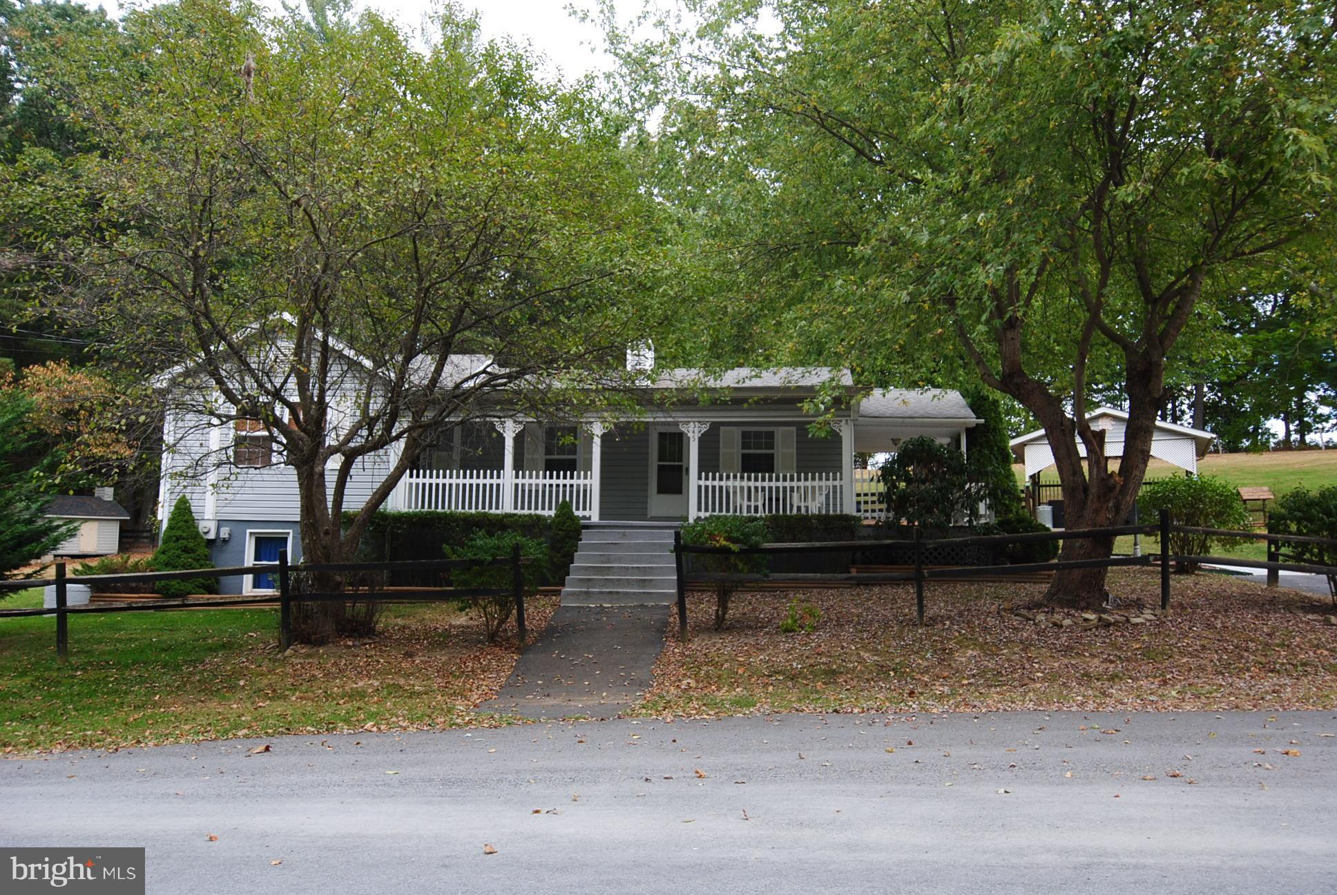 345 Sinking Spring Lane Gore, VA 22637 - Photo 1 of 30 a front view of a house with a yard