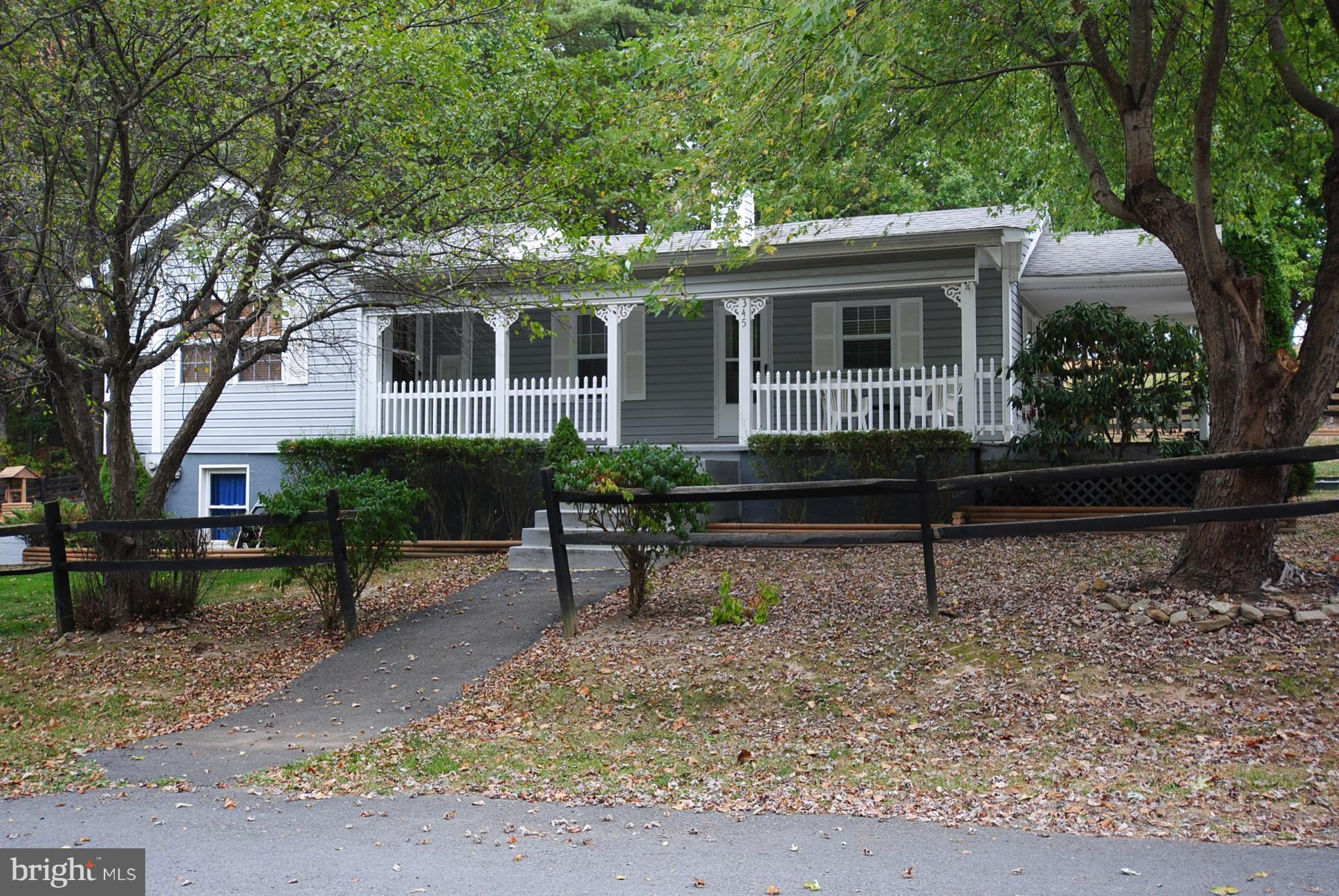 345 Sinking Spring Lane Gore, VA 22637 - Photo 2 of 30 a view of house with a yard and sitting area