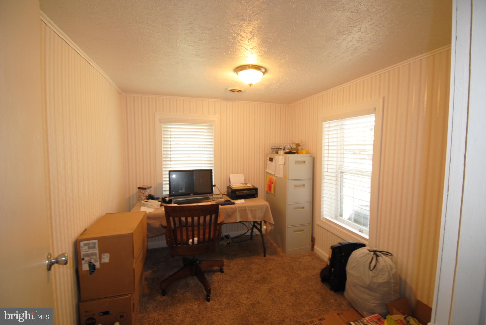 345 Sinking Spring Lane Gore, VA 22637 - Photo 11 of 30 a view of a workspace with furniture and a window