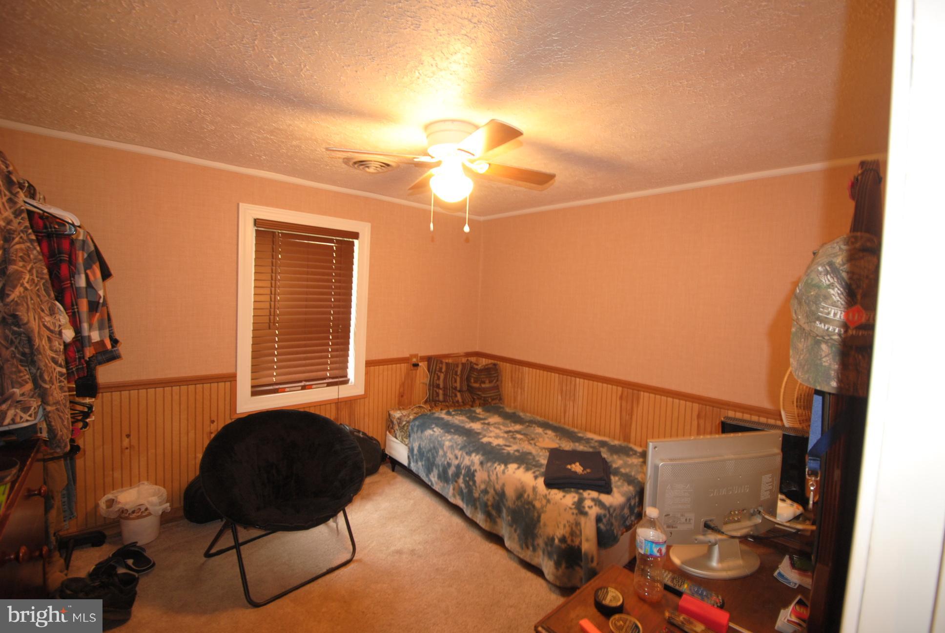345 Sinking Spring Lane Gore, VA 22637 - Photo 12 of 30 a bedroom with bed and a window