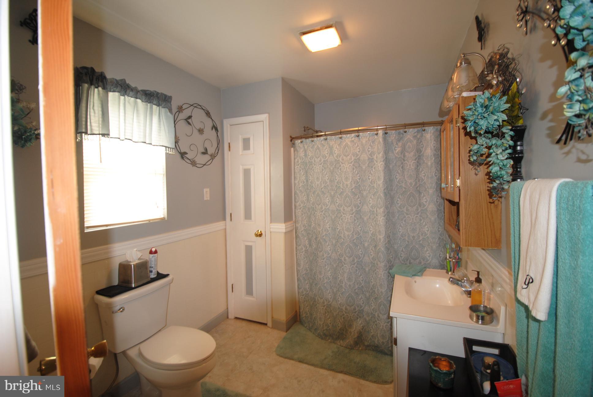 345 Sinking Spring Lane Gore, VA 22637 - Photo 16 of 30 a bathroom with a sink toilet and shower