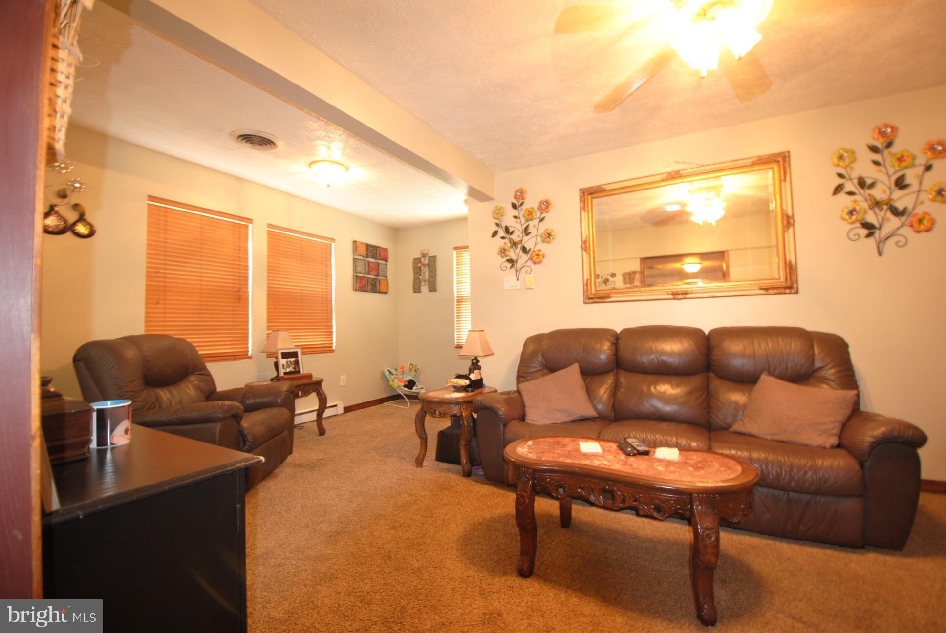 345 Sinking Spring Lane Gore, VA 22637 - Photo 9 of 30 a living room with furniture and a large window