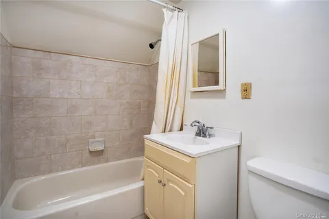 a bathroom with a sink toilet and vanity