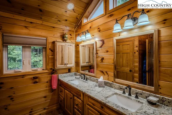 a view of a bathroom with a tub and shower