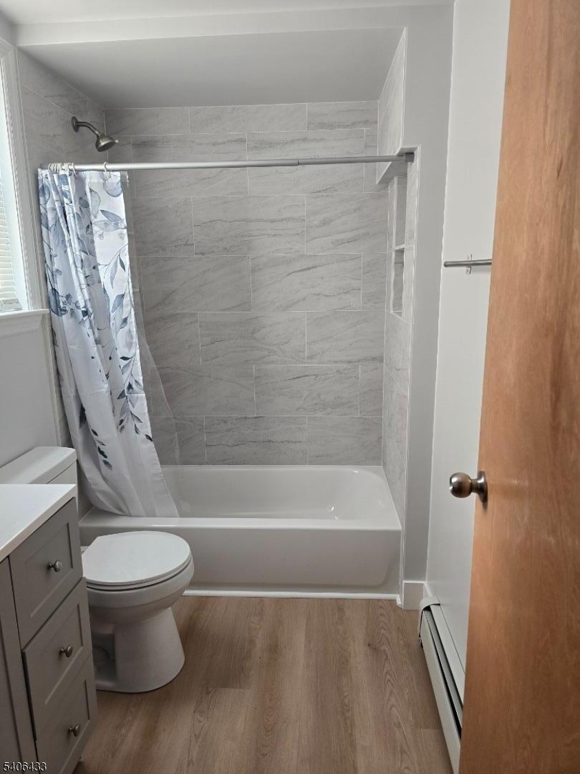 110 Elm Street Newark, NJ 07105 - Photo 11 of 11 a bathroom with a toilet and a bathtub