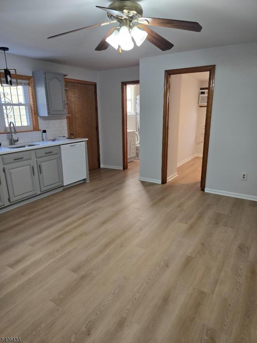 110 Elm Street Newark, NJ 07105 - Photo 10 of 11 a view of a kitchen with a sink cabinet window and wooden floor