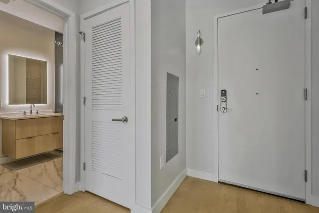 a view of bathroom with a shower and a sink