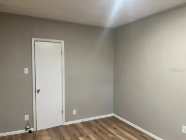 a view of small space with wooden floor