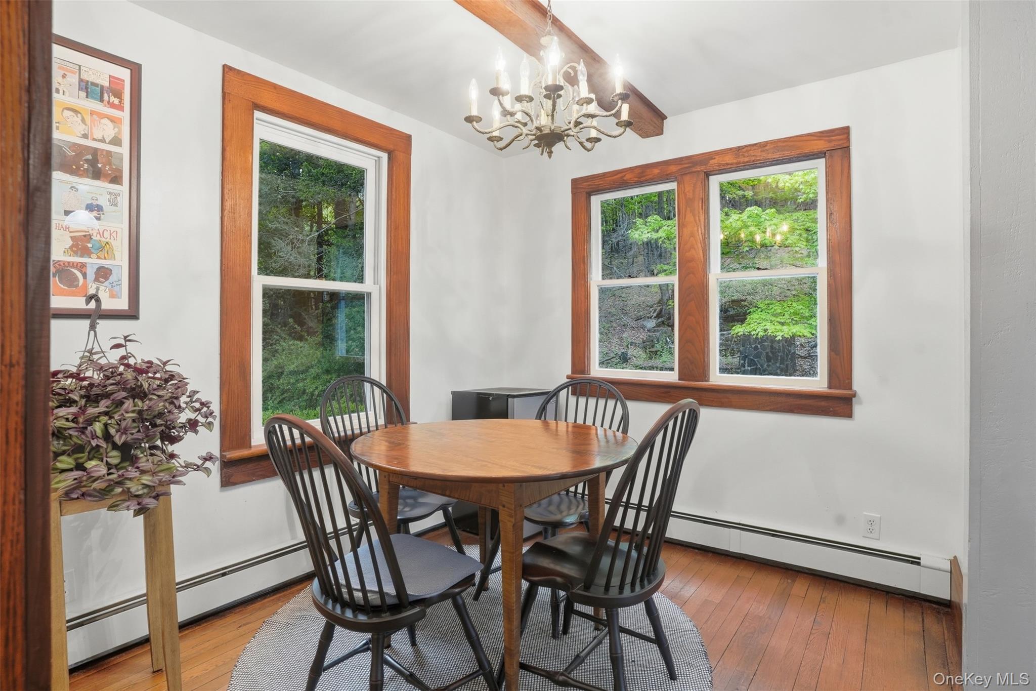 726 Wittenberg Road Mount Tremper, NY 12457 - Photo 13 of 32 a view of a dining room with furniture window and wooden floor