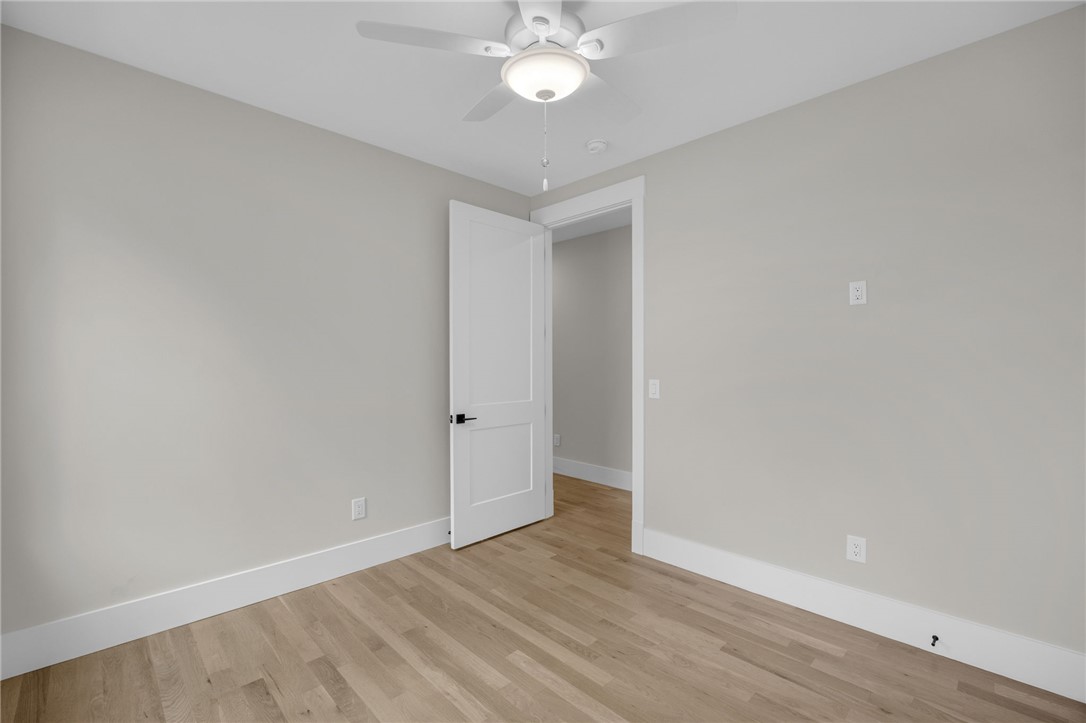 1230 Melton Road, Unit 216 West Union, SC 29696 - Photo 19 of 49 Blonde hardwood floors complement fresh wall tones in this spacious, well-lit bedroom.