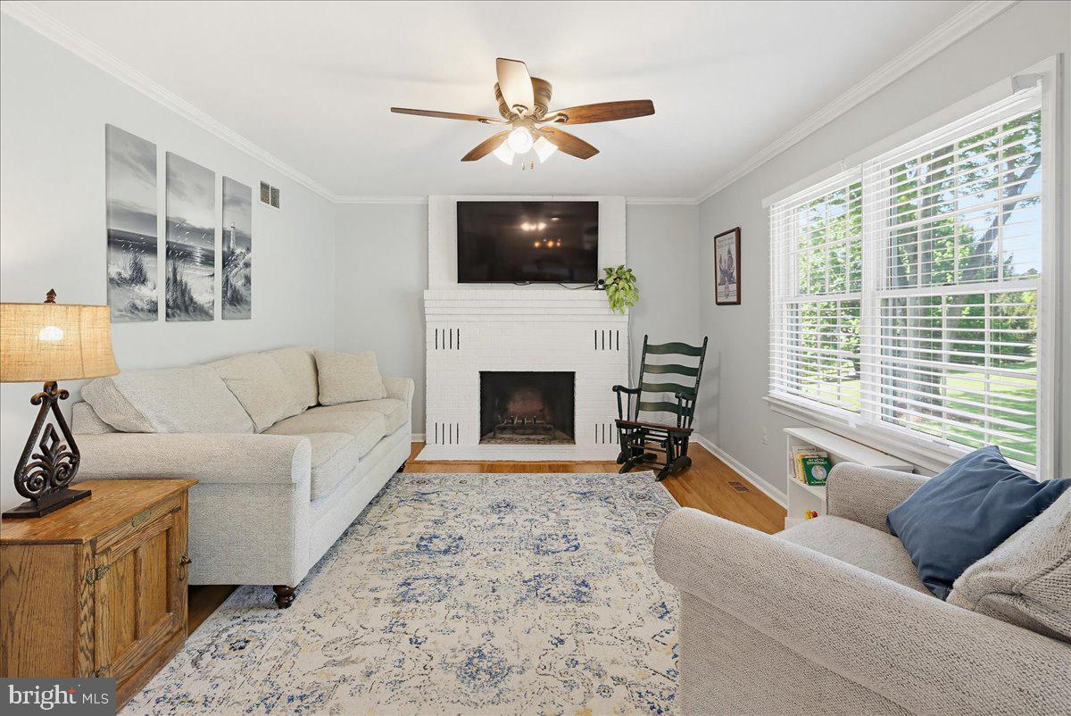 20128 Gunpowder Road Manchester, MD 21102 - Photo 12 of 66 a living room with furniture a flat screen tv and a fireplace