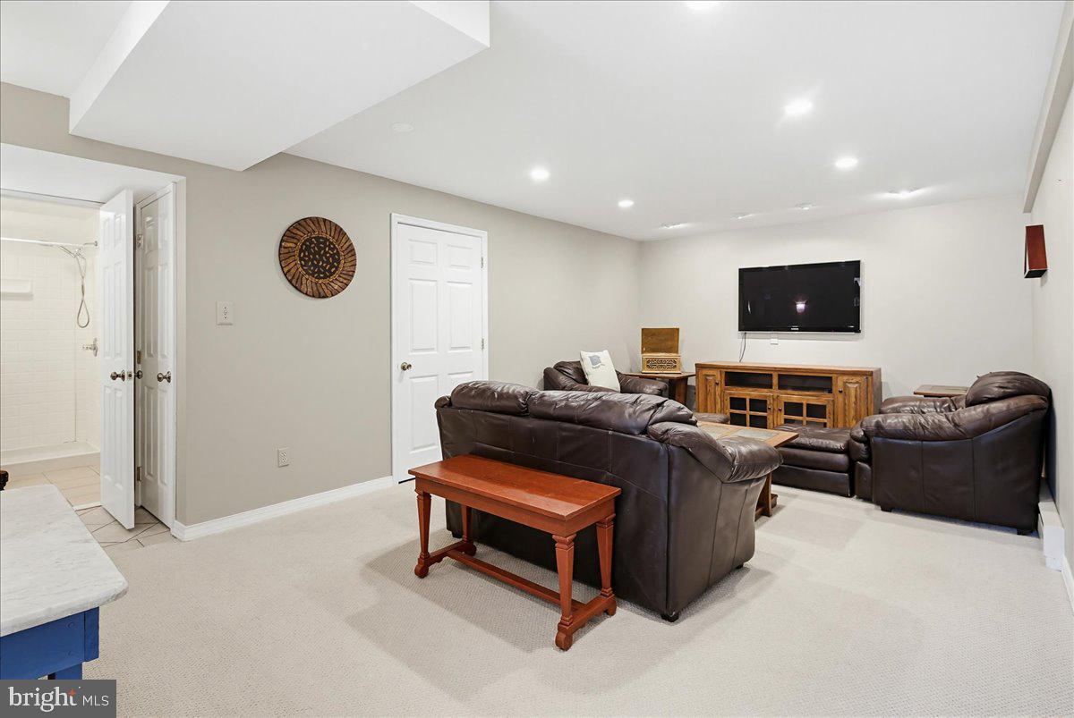 20128 Gunpowder Road Manchester, MD 21102 - Photo 33 of 66 a living room with a couch and a flat screen tv