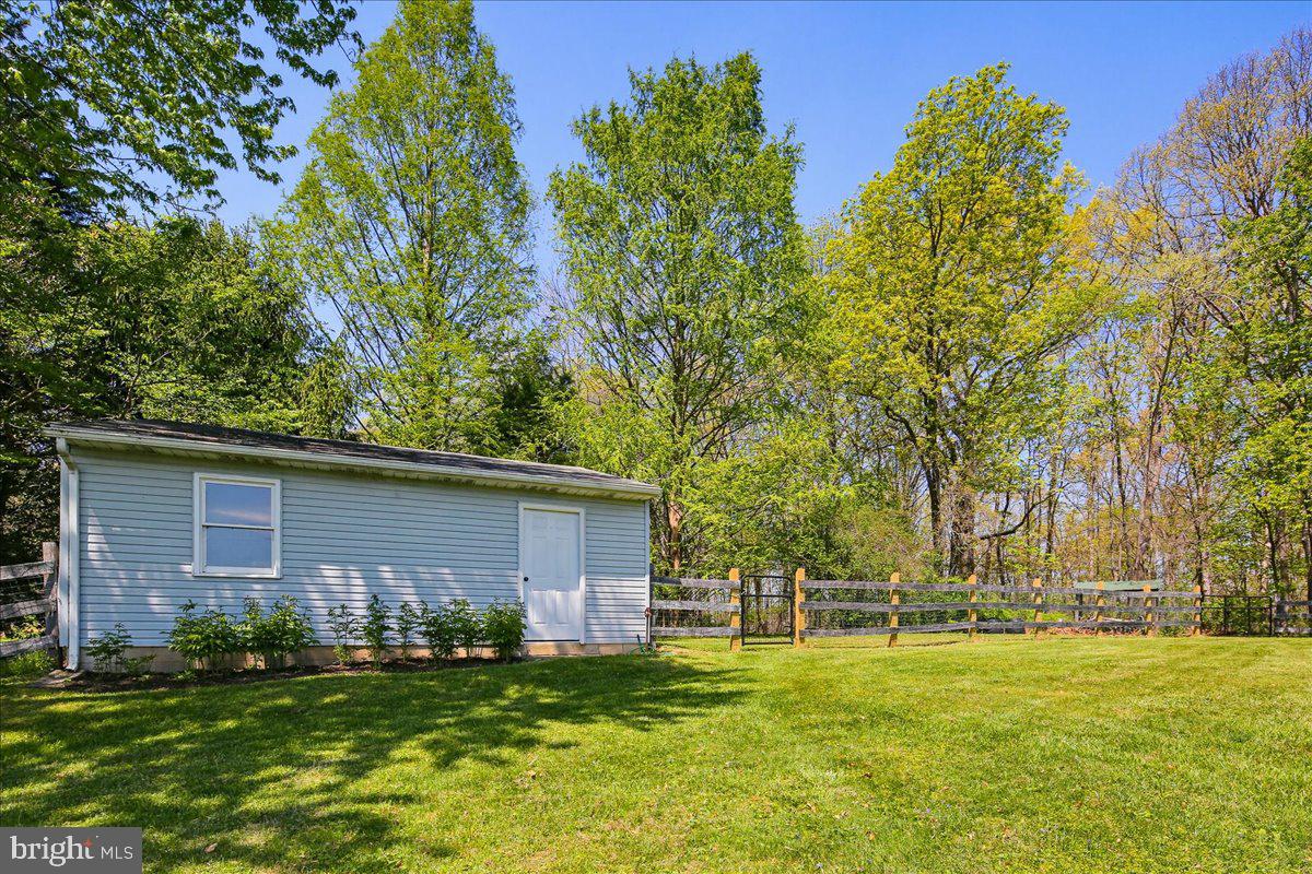 20128 Gunpowder Road Manchester, MD 21102 - Photo 48 of 66 a front view of house with yard and trees