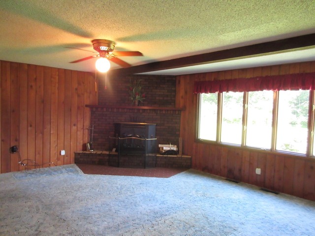 2118 Grand Detour Road Dixon, IL 61021 - Photo 13 of 16 a living room with furniture and a fireplace