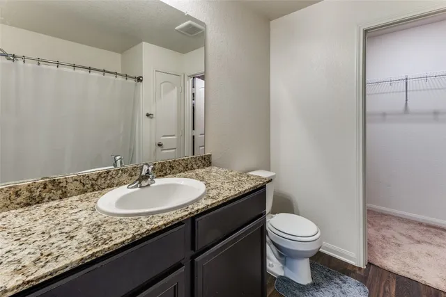 a bedroom with a bed and a view of bathroom