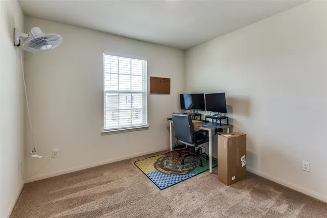 a bathroom with a granite countertop sink toilet and a mirror