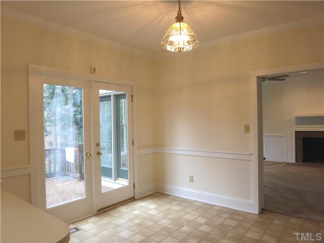 10012 Old Warden Road Raleigh, NC 27615 - Photo 11 of 25 Over the eat-at peninsula is the sunny Bfast area w/desk & French drs to the Deck. Nearby is the Utility Hall (w/sep front entrance, lg closet, Half Bath, back entrance from Deck, & back stairs to the Bonus Rm) to the spacious 2-car side-load Garage. Breakfast Area