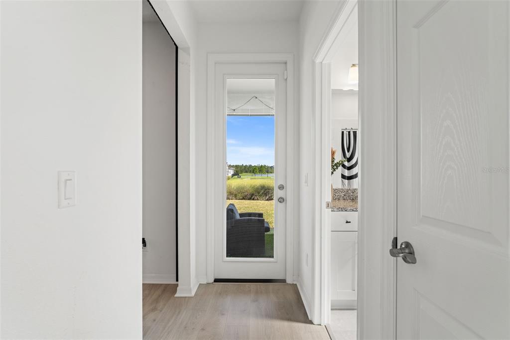 5945 Newberry Pnes Avenue Wesley Chapel, FL 33545 - Photo 24 of 55 a view of a hallway with wooden shelves