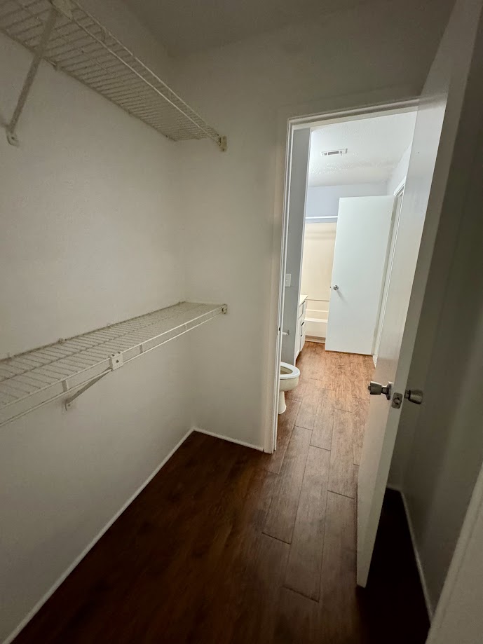 1305 West Villa Maria Road, Unit C107 Bryan, TX 77801 - Photo 17 of 19 wooden floor in an empty room